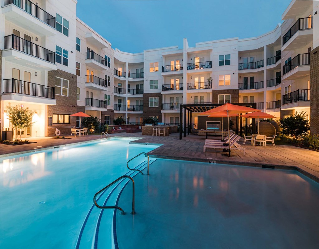 A large swimming pool in front of apartment buildings at Hudson at Renaissance Apartments, Wilmington, North Carolina