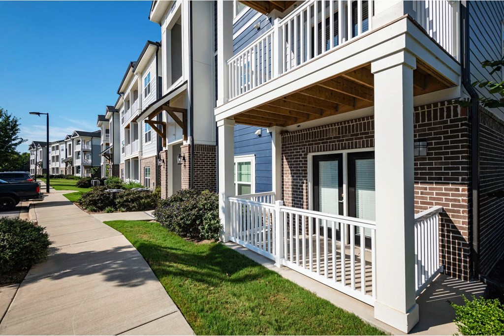 A row of apartment buildings with white railings and balconies at Waterleaf at Neely Ferry Apartments, Simpsonville, 29680