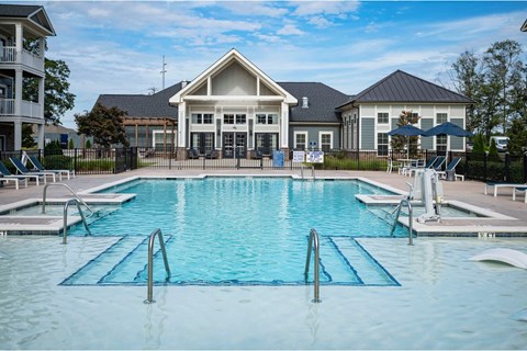 A large swimming pool in front of a building at Waterleaf at Neely Ferry Apartments, South Carolina