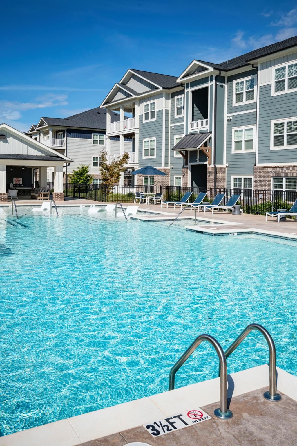 A swimming pool with a 3ft sign on the edge at Waterleaf at Neely Ferry Apartments, South Carolina 29680