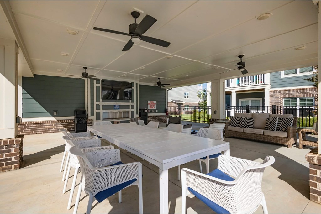 A patio with a white table at Waterleaf at Neely Ferry Apartments, South Carolina
