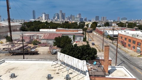 A cityscape with buildings and a clear sky.