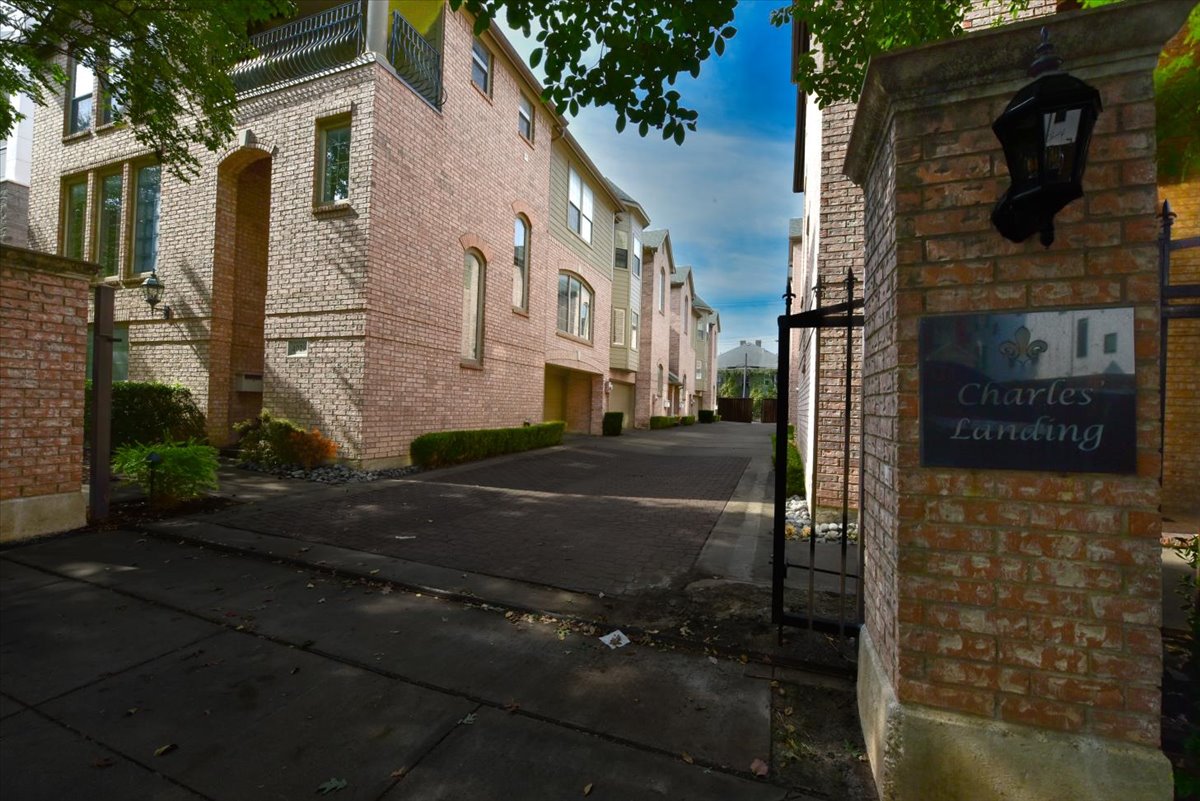 A brick building with a sign that says Charles Landing.
