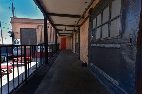 A long, narrow alley with brick buildings on either side.