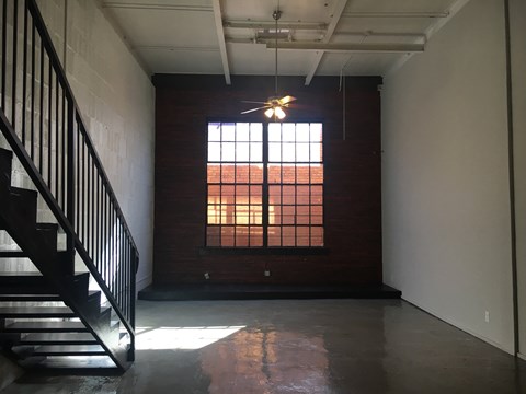A room with a staircase and a window.