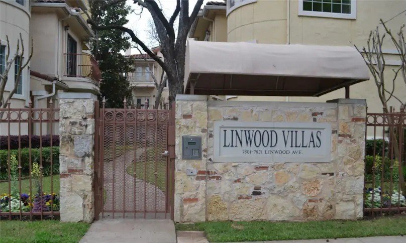 The entrance to Linwood Villas is marked by a stone wall and gate.