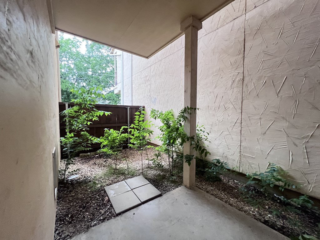 A white wall with a pattern of scratches on it.