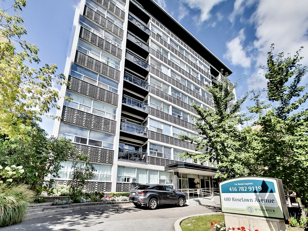a car parked in front of an apartment building