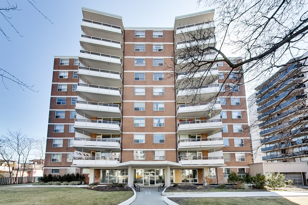 A large apartment building with a lot of windows and balconies.