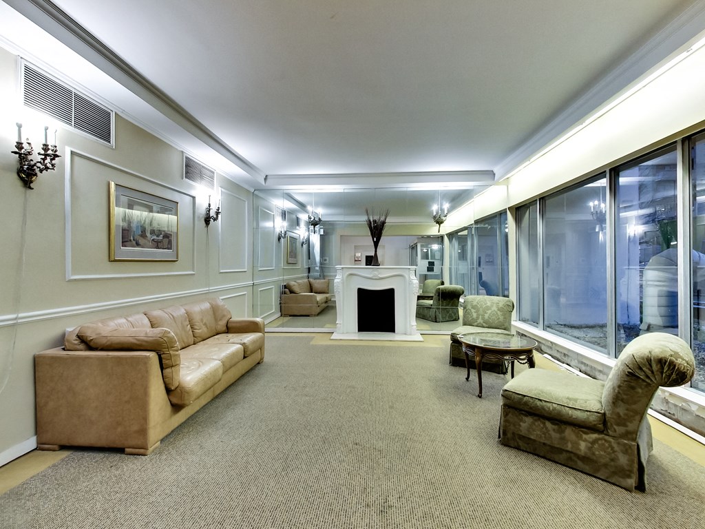 A living room with a fireplace and a couch.