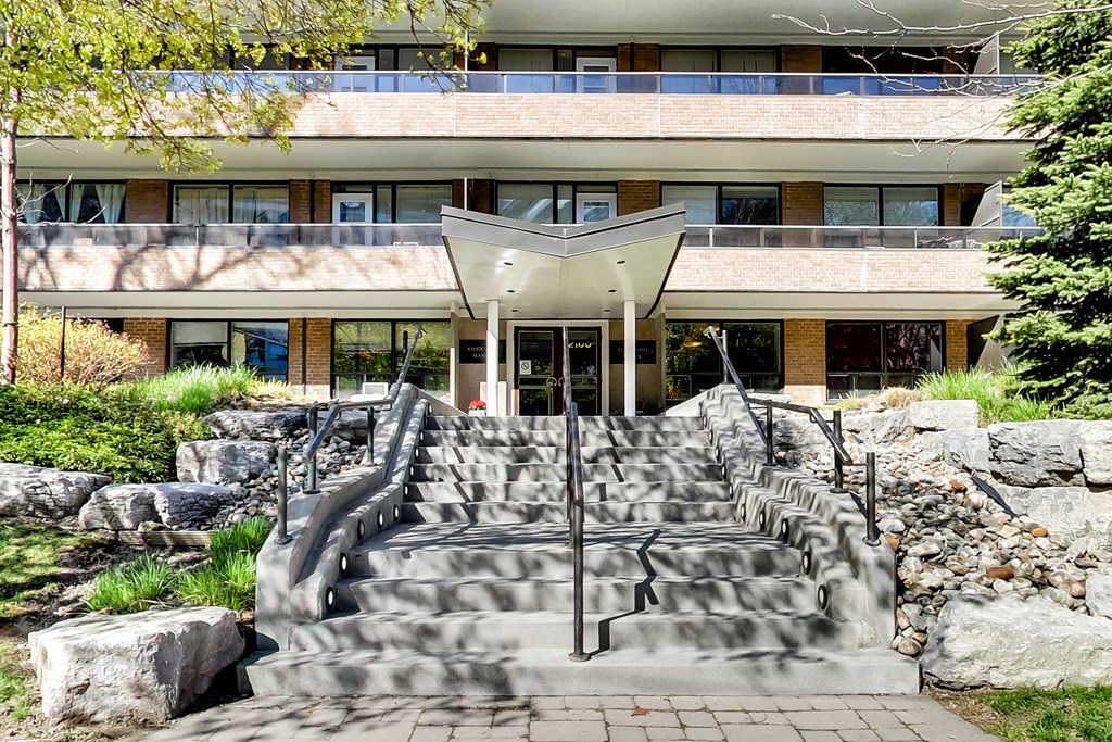 a building with a set of stairs and a fountain