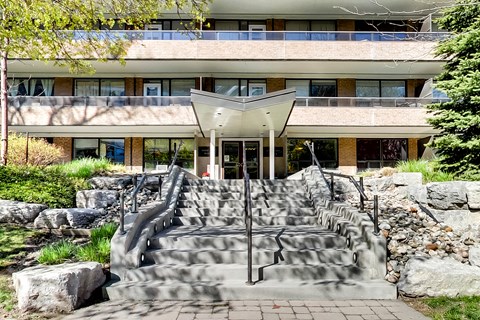 a building with a set of stairs and a fountain