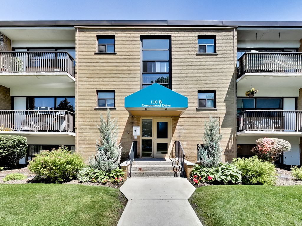 A building with a blue awning that says "Contractors In" is shown.