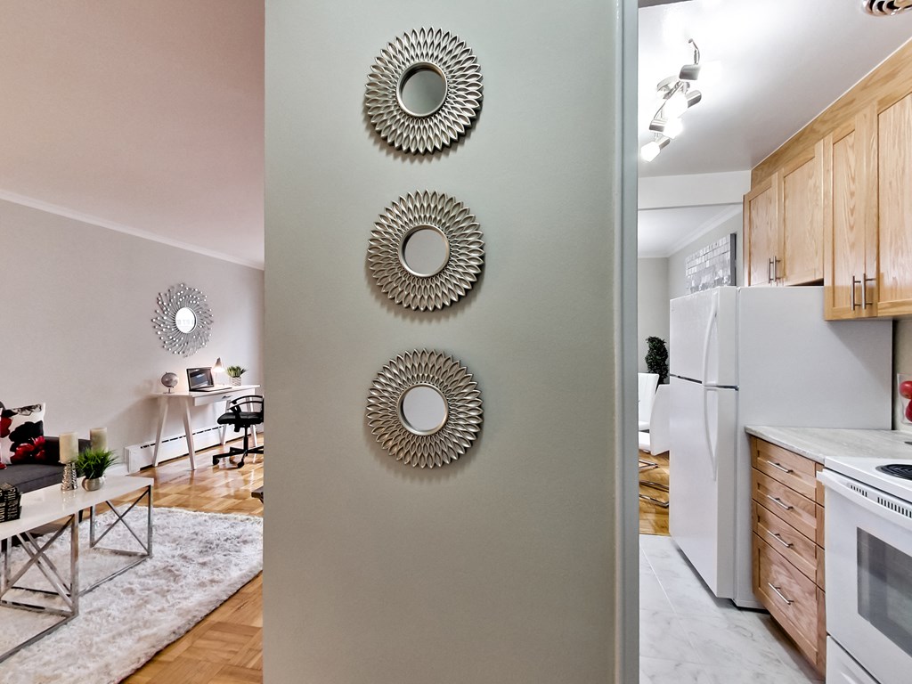 a view of a kitchen and living room from behind a door