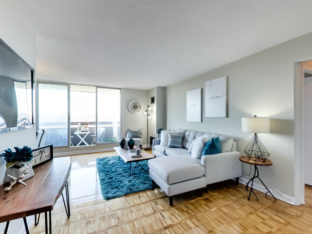 a living room with a couch and a chair and a table
