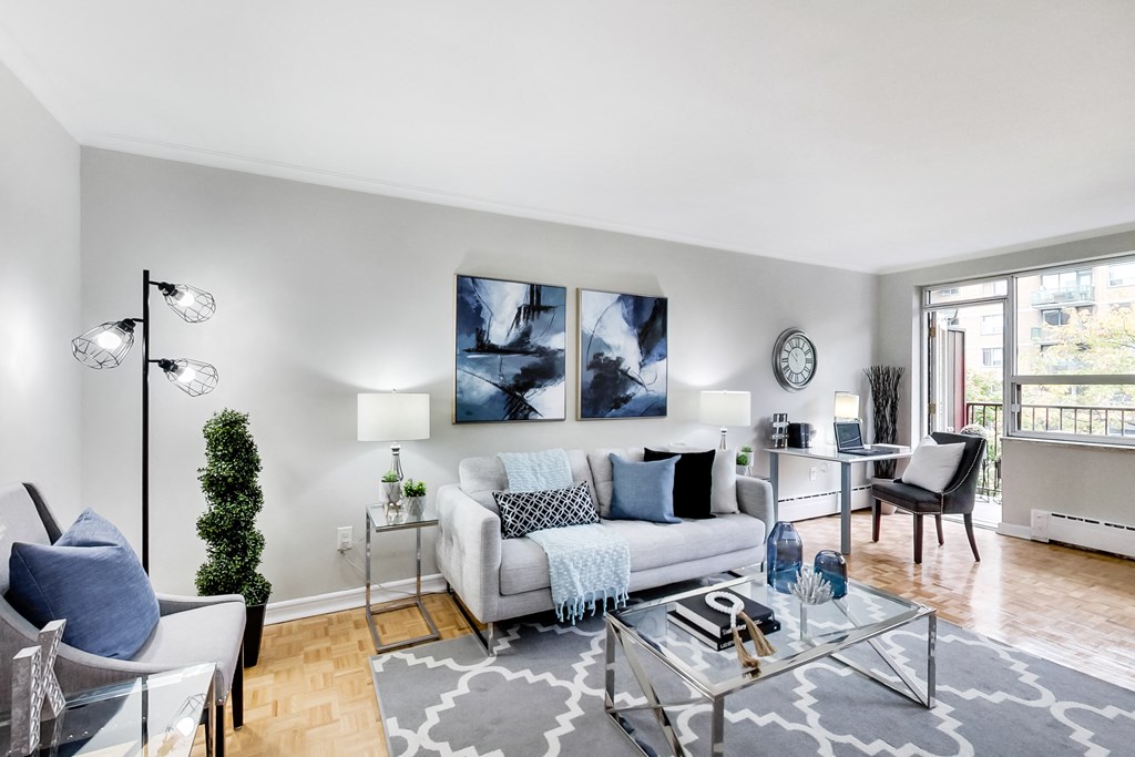 a living room with a couch and a glass table