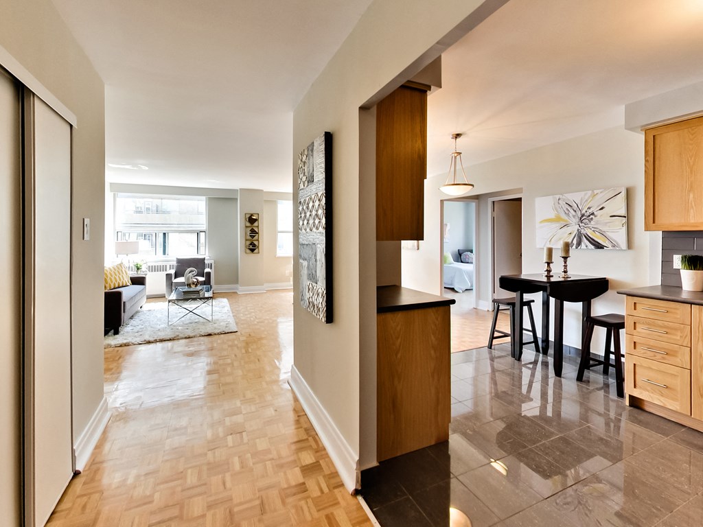 a view from the living room into the kitchen and dining room of a house