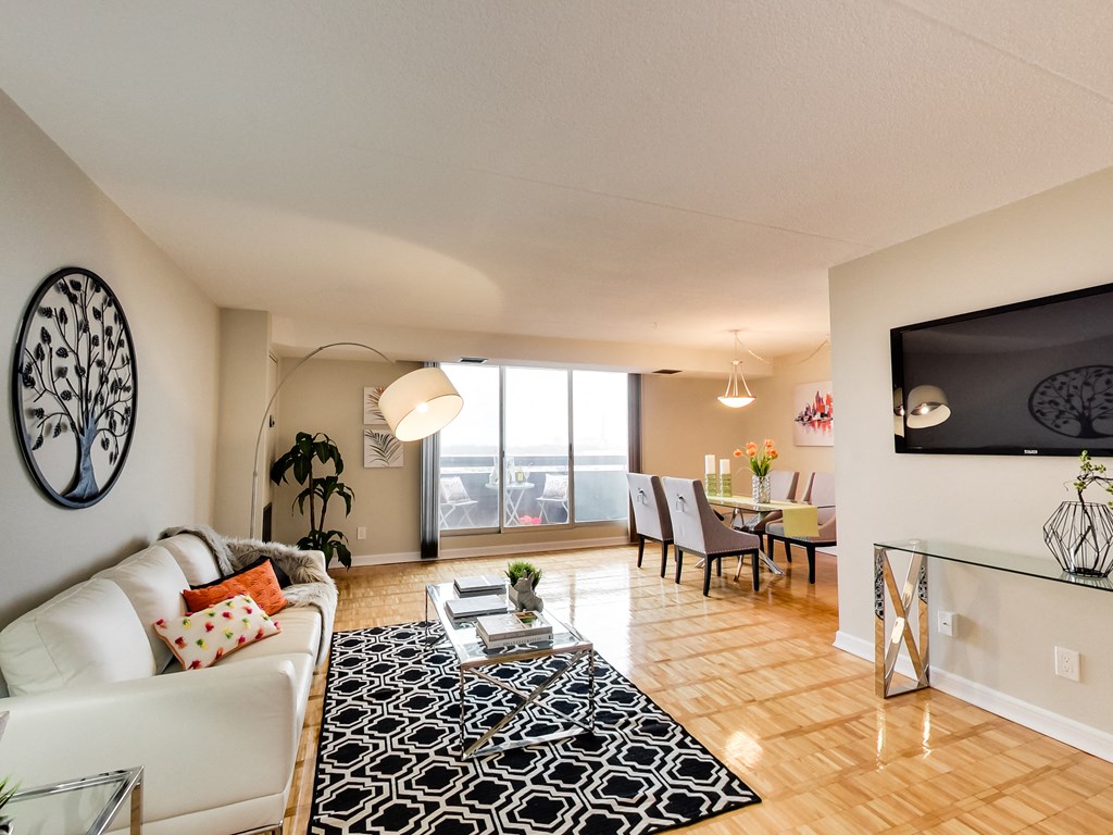 a living room with a couch and a table and a tv