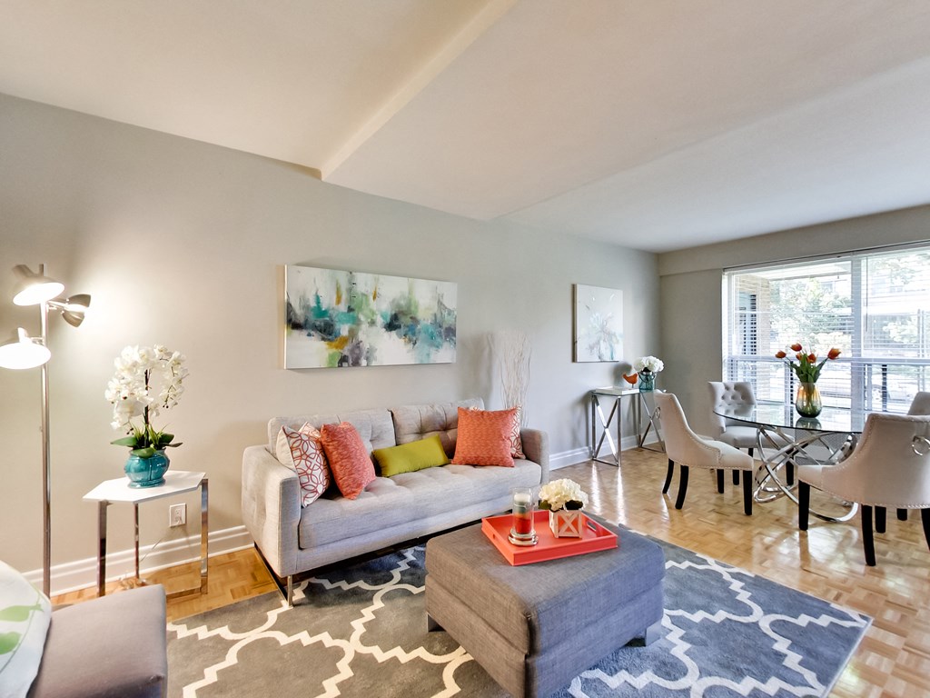 a living room with a couch and a dining room table