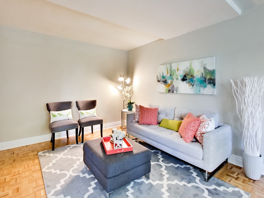 a living room with a couch and two chairs