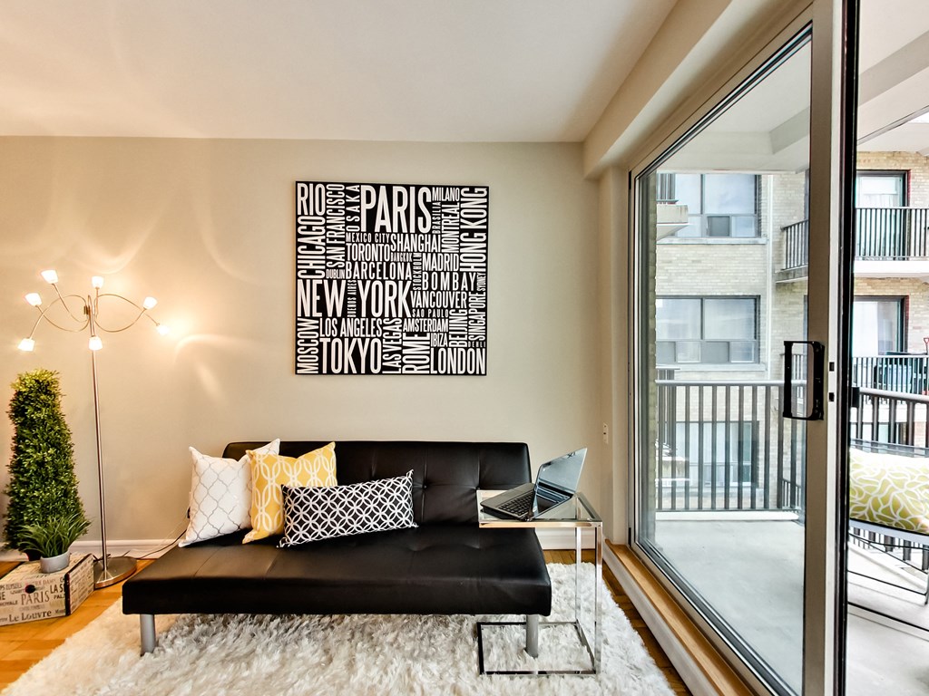 a living room with a couch and a large window
