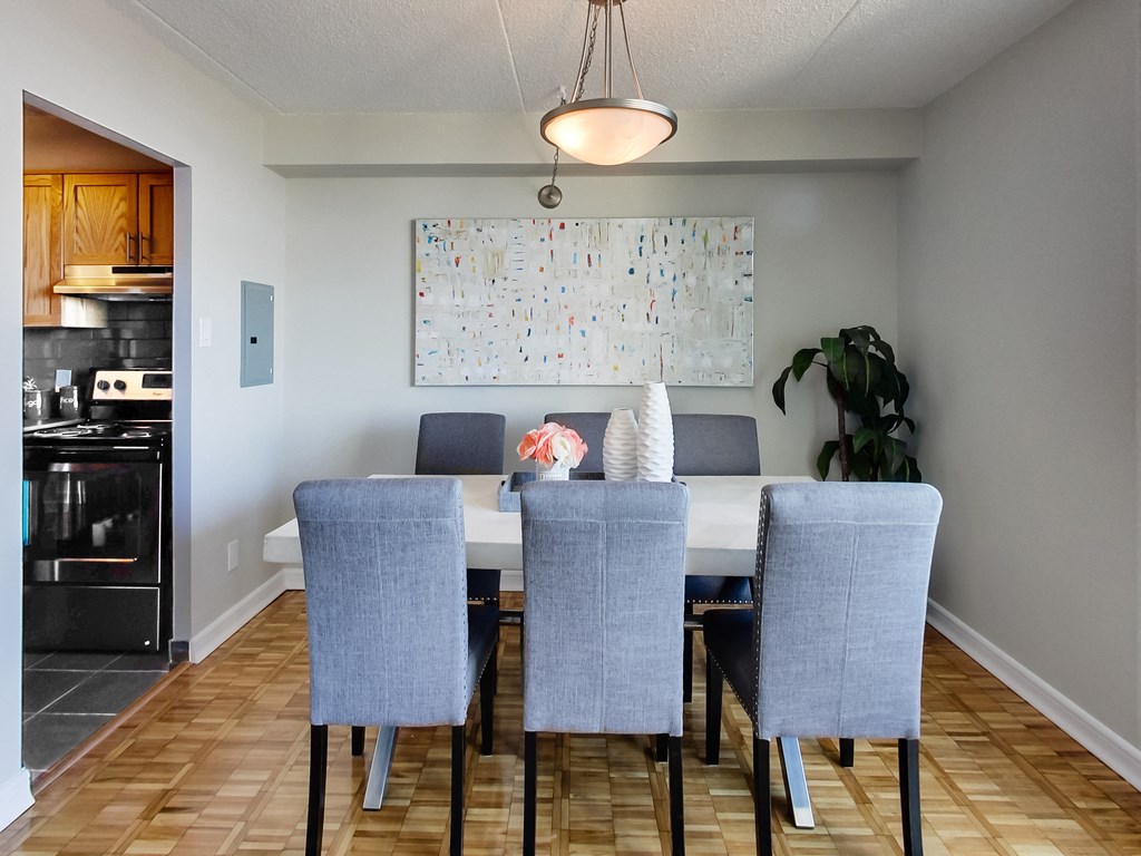 an image of a dining room with a table and chairs