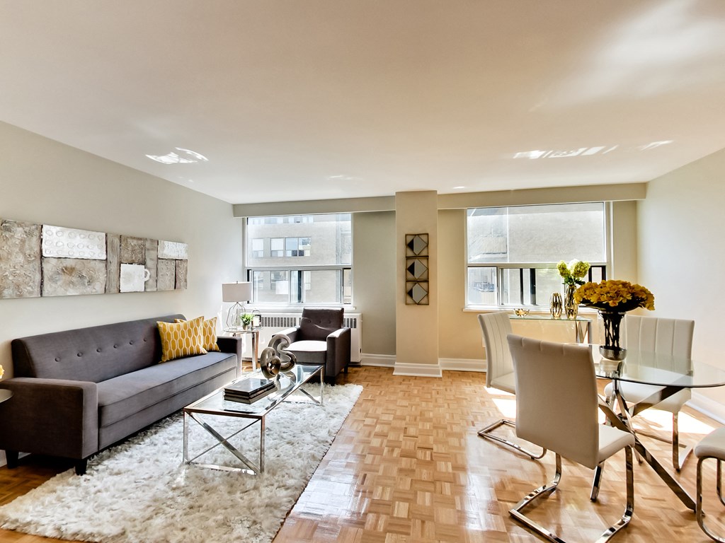 a living room and dining room with a couch and a table