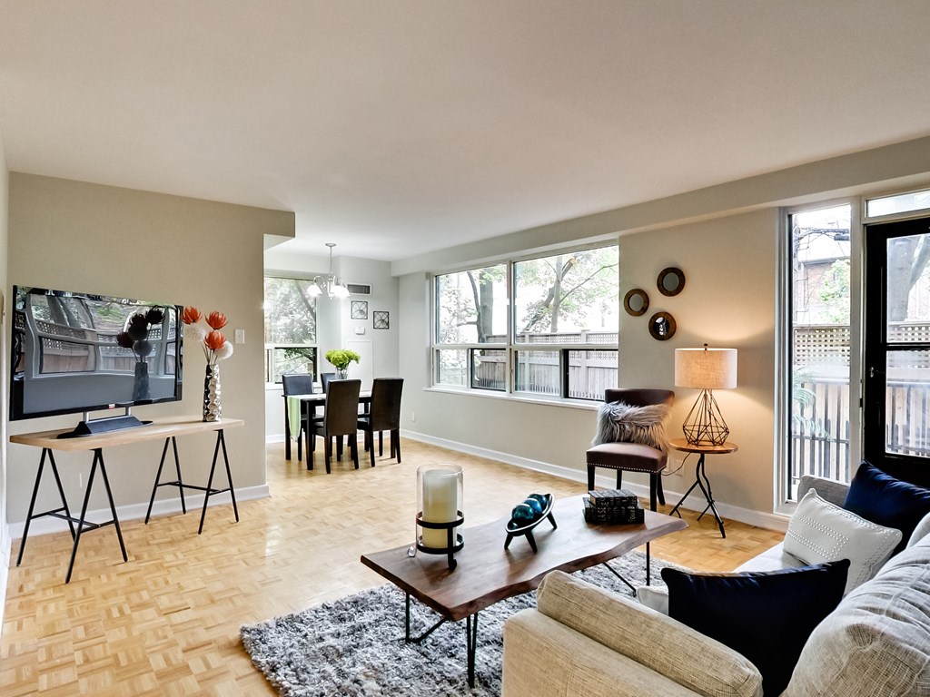 a living room with a couch and a coffee table and a television