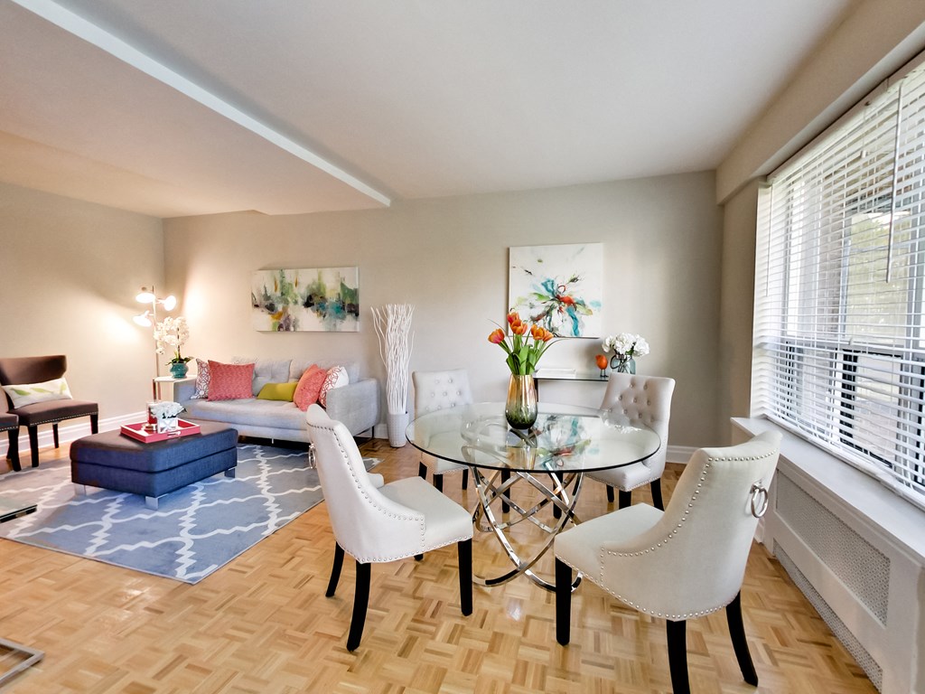 a living room with a table and chairs and a couch