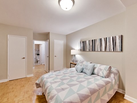 a bedroom with a bed and a closet