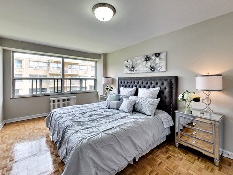 a bedroom with a large bed and a window