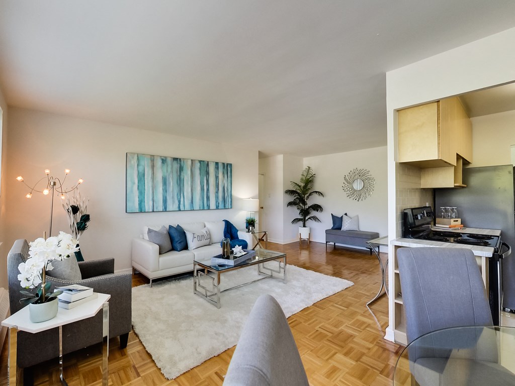 a living room with couches and chairs and a table