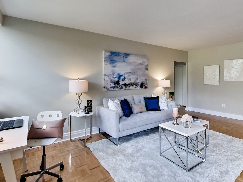 an open living room with a couch and a table