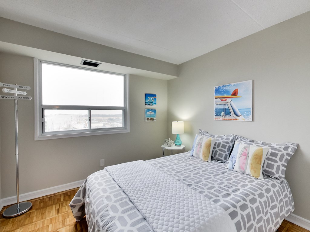 a bedroom with a large bed and a window