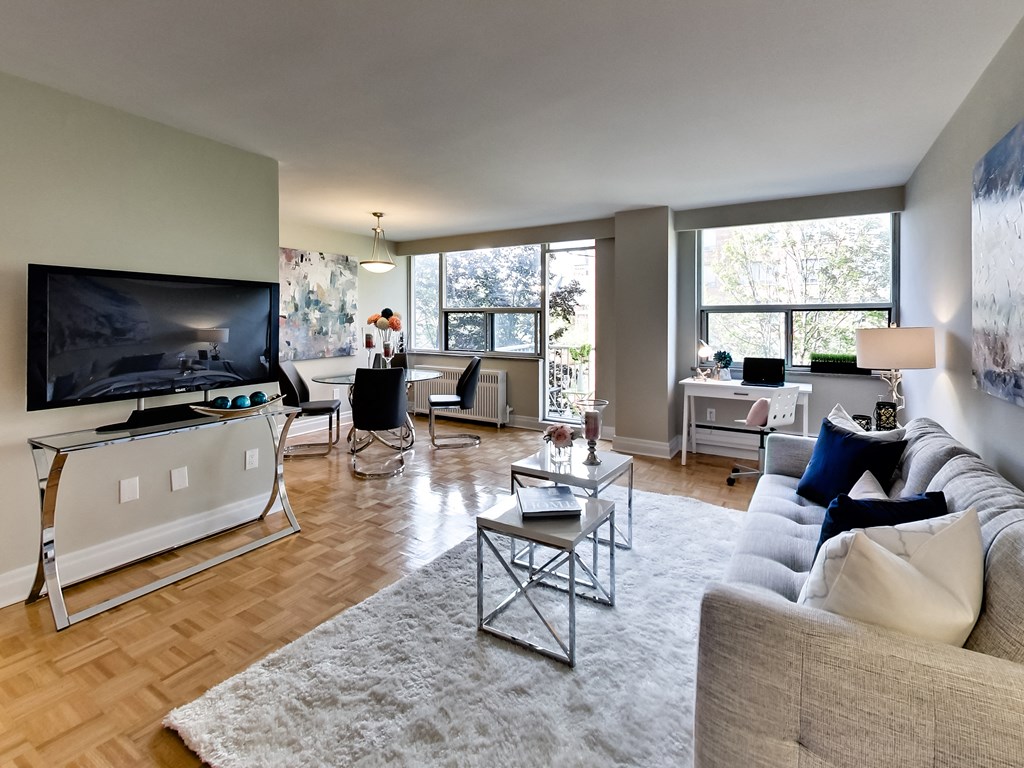 an open living room with a couch and a tv