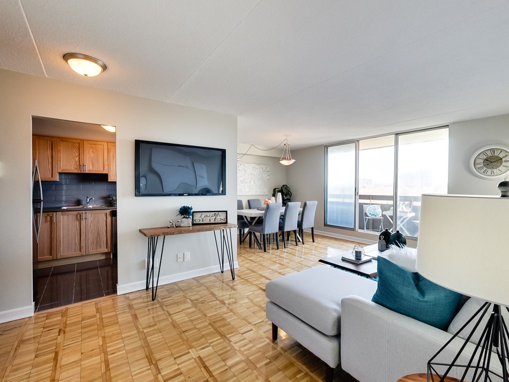 a living room with a couch and a table with chairs