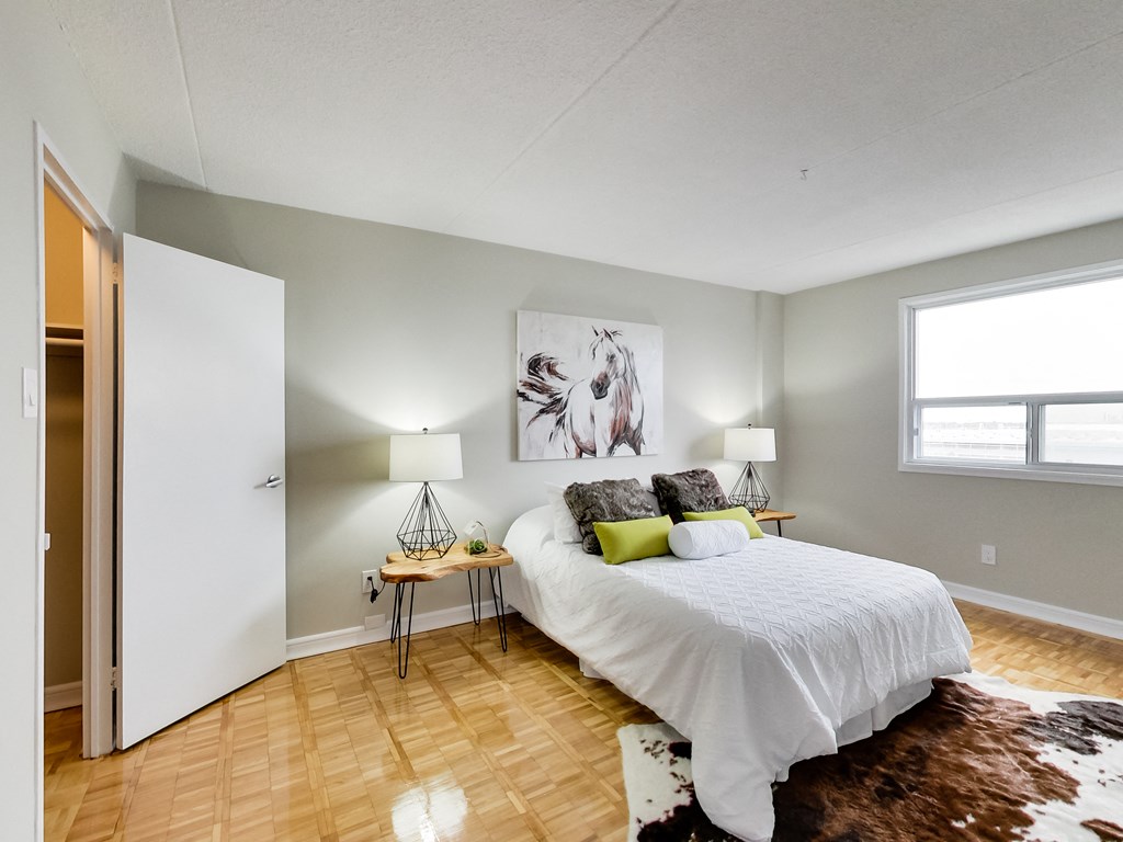 a bedroom with a bed and a window