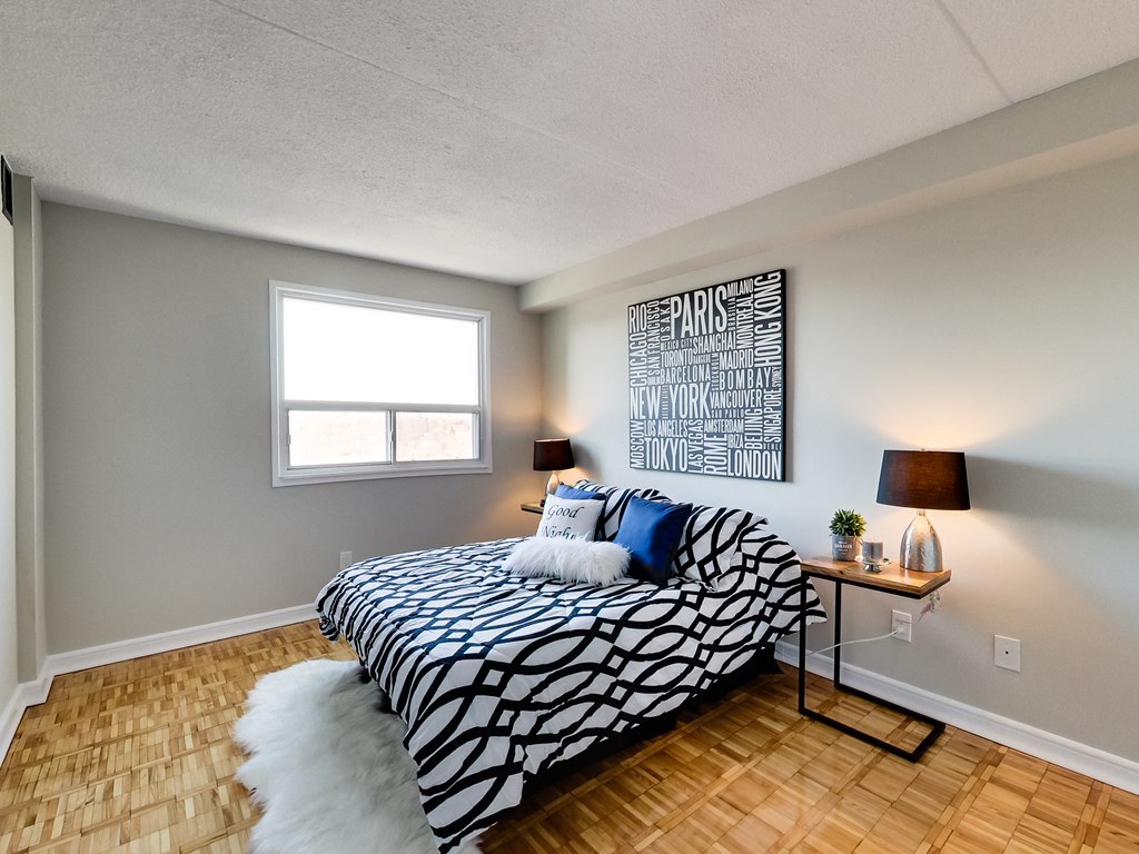 a bedroom with a bed and a futon in it