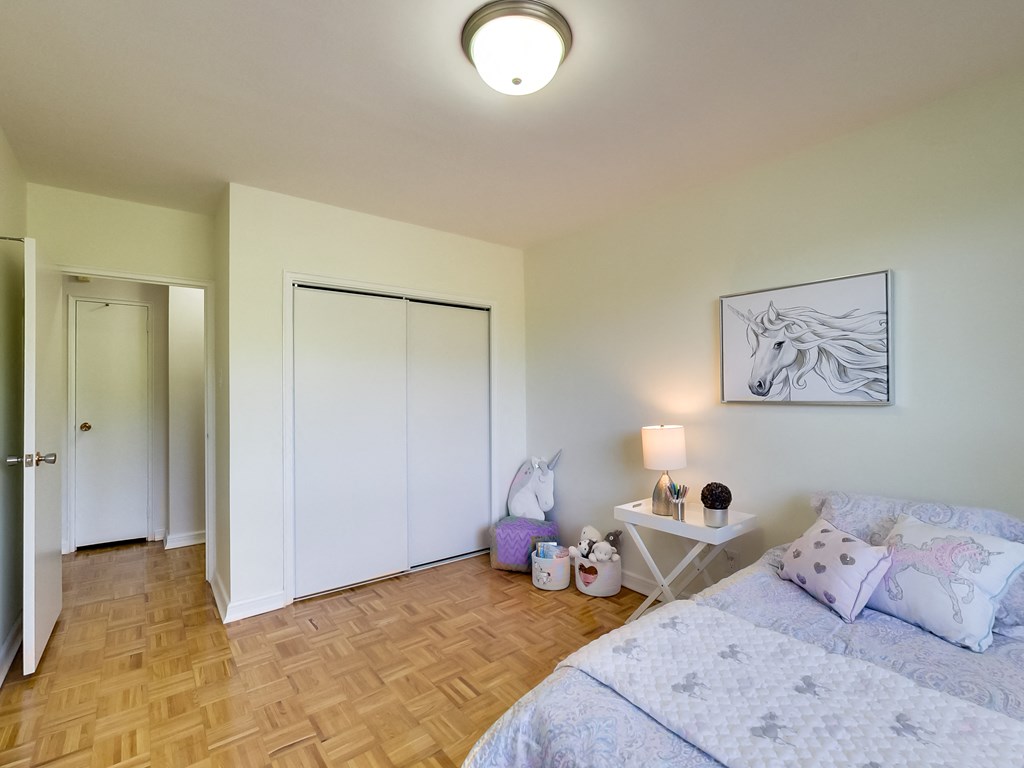 a bedroom with a bed and a closet