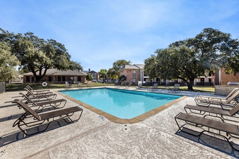 our apartments have a resort style pool with chaise lounge chairs