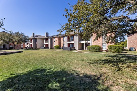 our apartments at the district feature a spacious yard and green grass