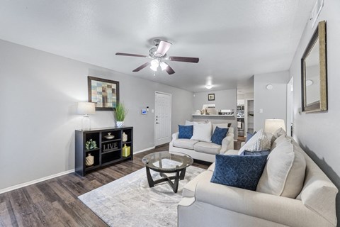 a living room with couches and a coffee table