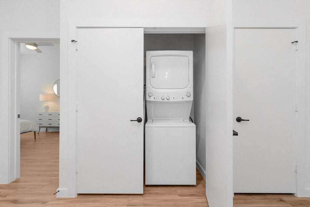a room with a washer and dryer in a closet
