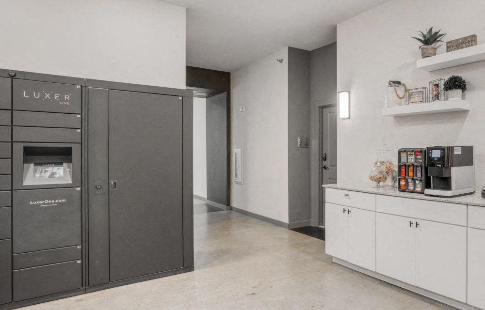 a kitchen with stainless steel appliances and white cabinets