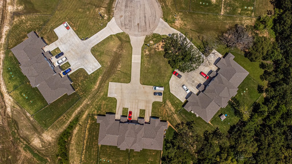 an aerial view of a neighborhood with houses shaped like crosses