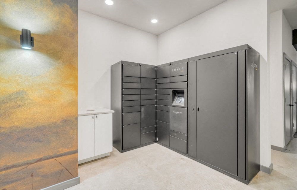 a laundry room with stainless steel appliances and a white closet