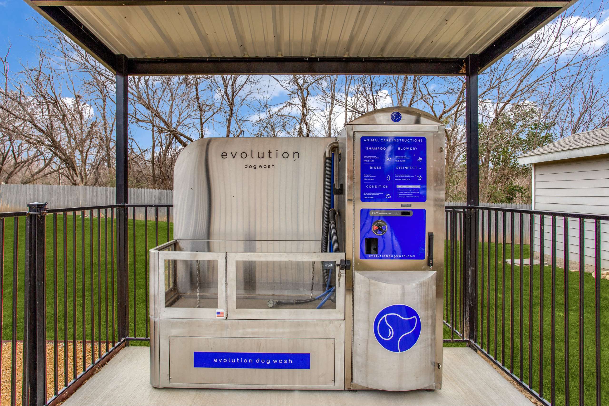 a generator in aenced in area with a fence and grass