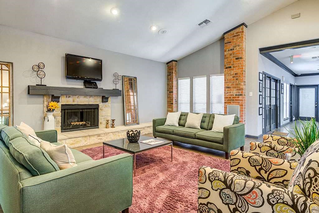 a living room with couches and a fireplace