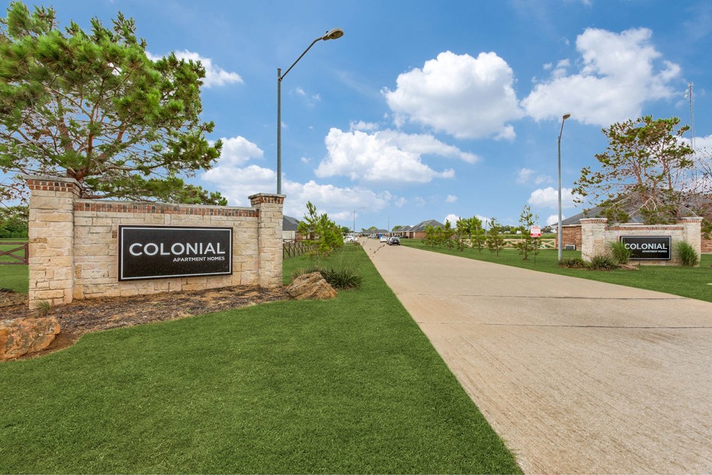 the subdivision is located on the side of a road with a street sign