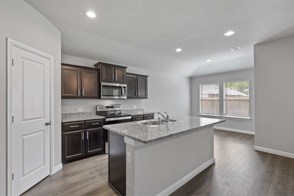 a kitchen with a counter top and a sink